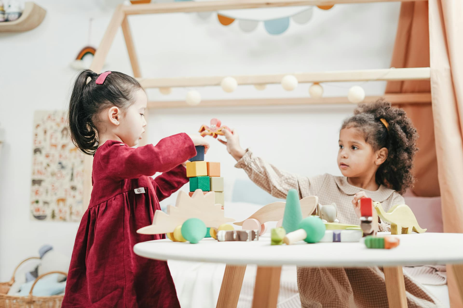 Children playing with wooden blocks at nursery